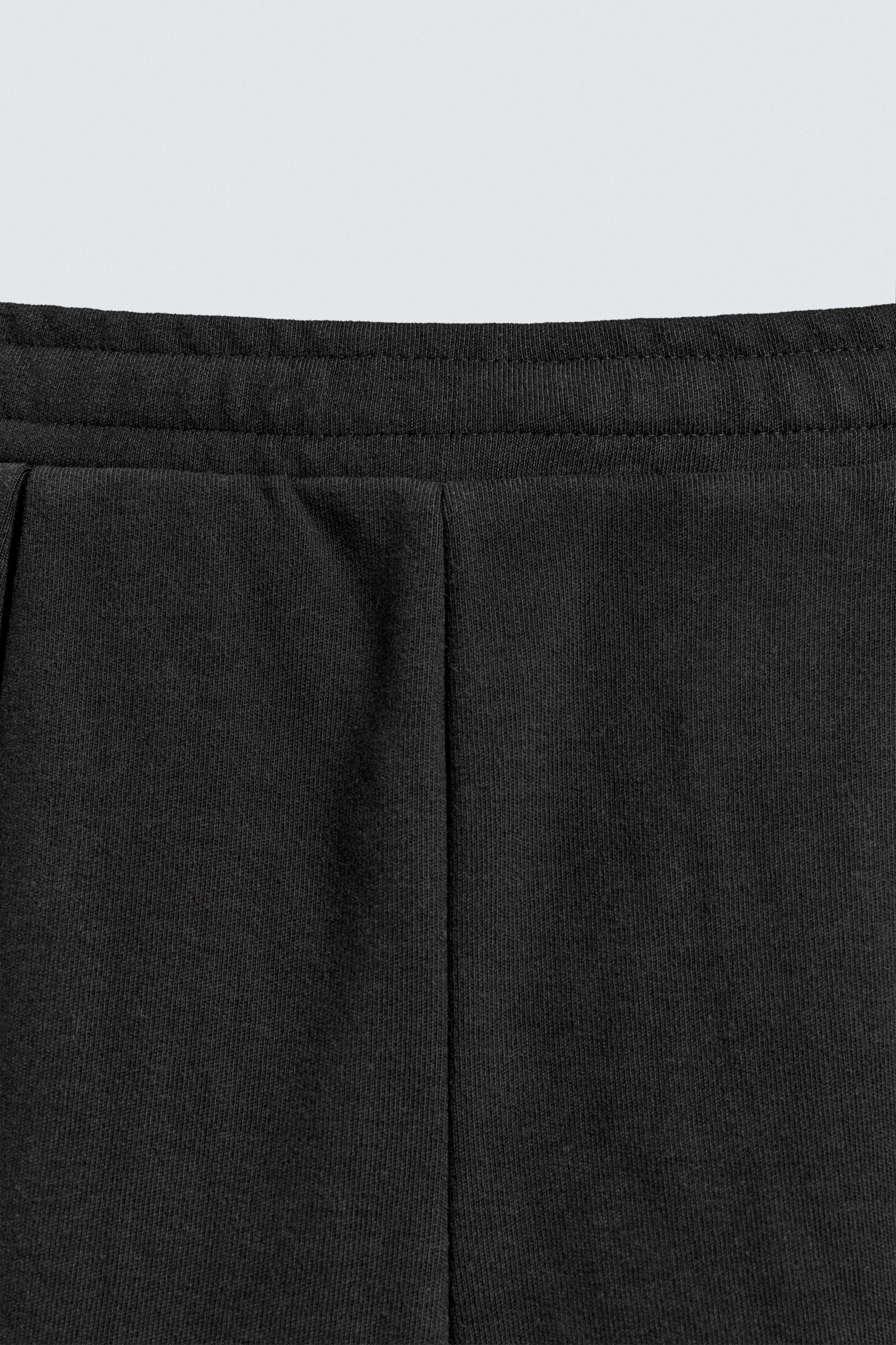 PLEATED WIDE FIT JOGGER PANTS